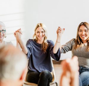 group-of-diverse-people-holding-hands-up-in-the-ai-MAJ7XT5-1.jpg